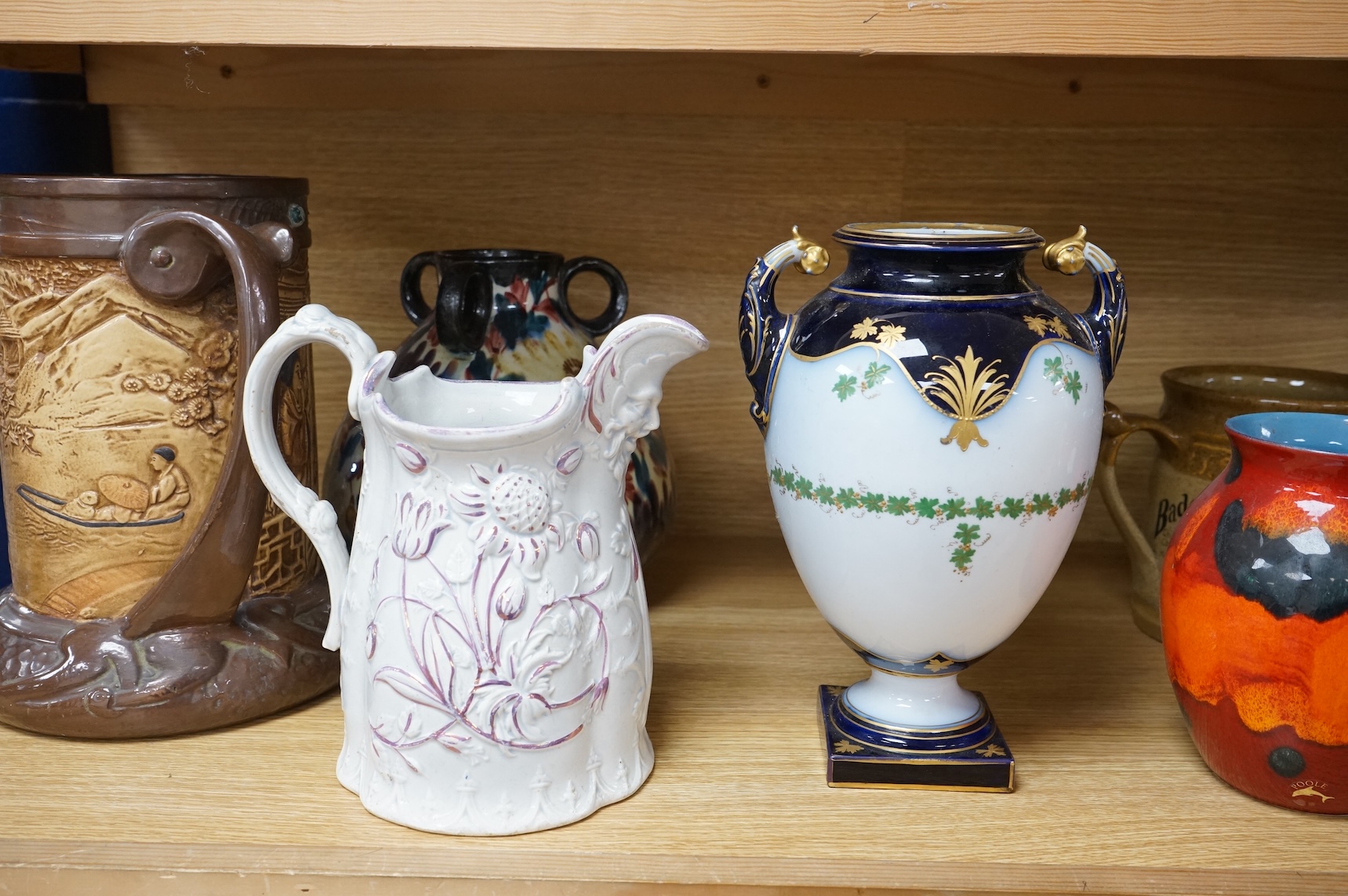A collection of seven various ceramic vessels including Bretby, Poole, Worcester, continental art pottery etc. 26cm